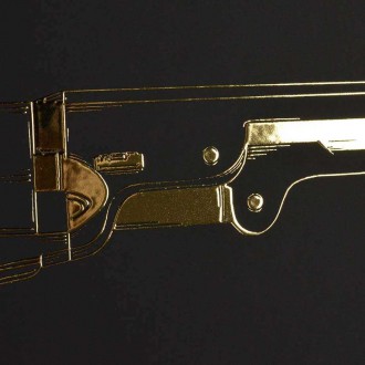 Revolver 3D Zlatý Plakát